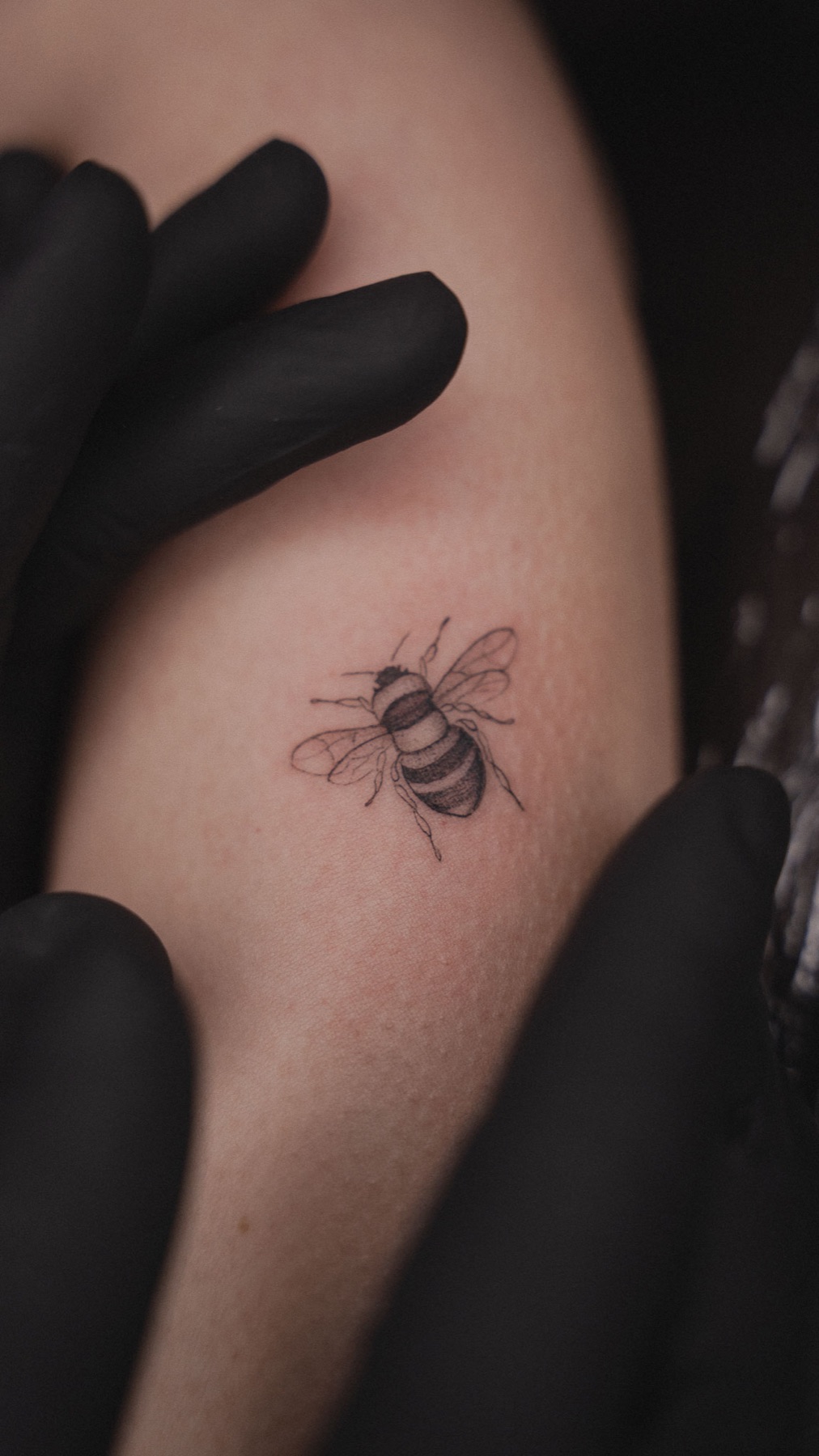 Small fine line bee tattoo